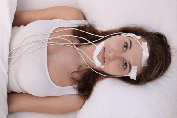 Young Woman Brainwaves Sleep Lab